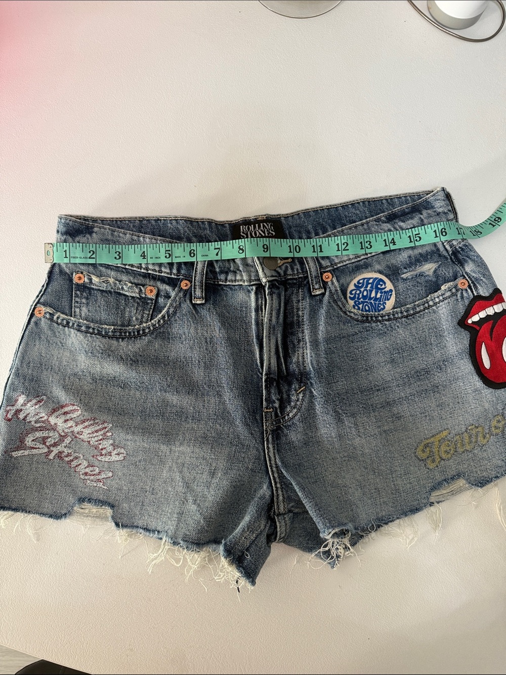 the Rolling Stones Distressed Denim Cutoff Shorts with Band Patch